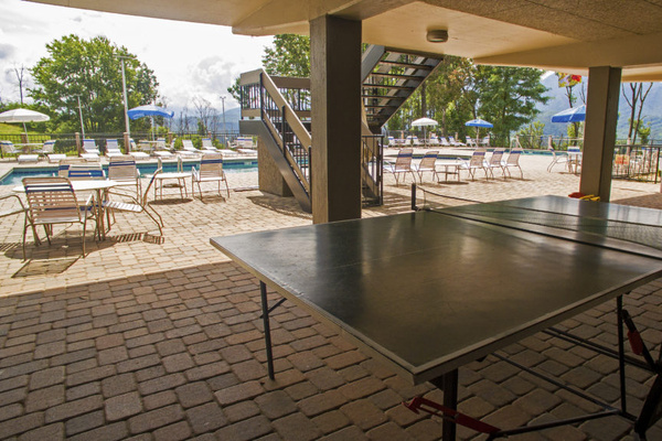 The North Clubhouse, one of three pool areas you will have access to during season features beautiful views, sunny double pools along with tennis, pickleball and ping pong recreation areas.