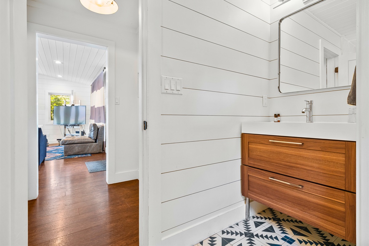 Bright hallway view leading from bedrooms to living areas—light and airy flow.