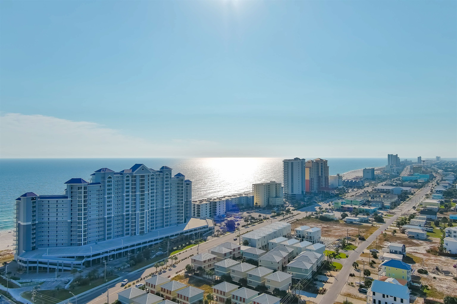 Aerial view of the Lighthouse Condos, showcasing our prime location near the best dining and entertainment in Gulf Shores.