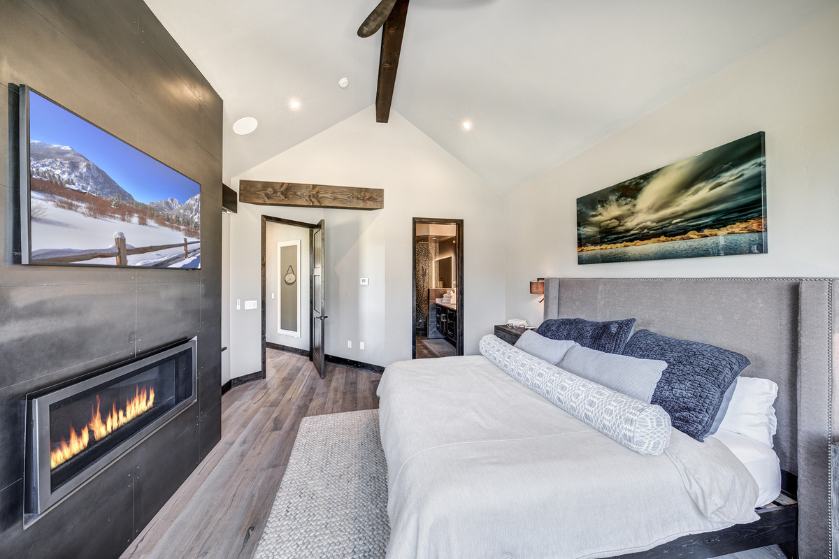 Bedroom #1 w/ensuite bath, private hot tub, fireplace, and laundry in closet.