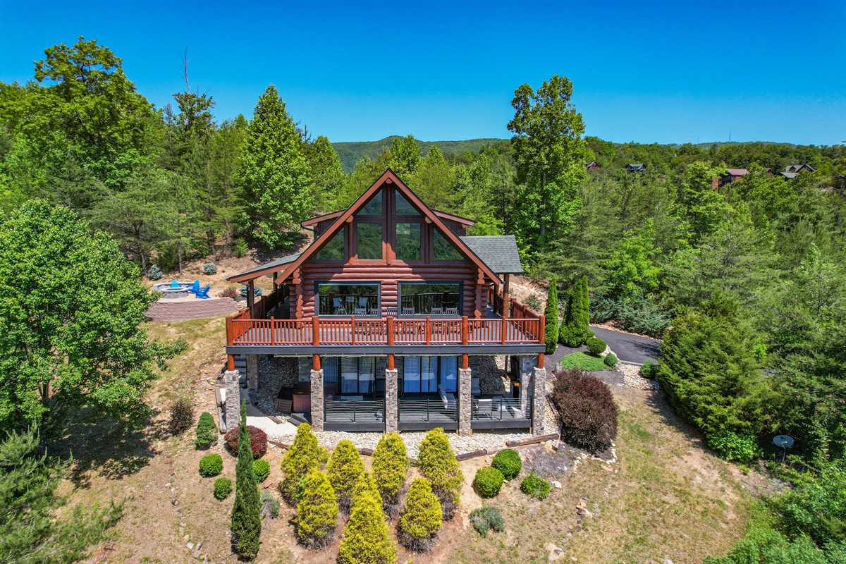 Experience the Beauty of the Great Smoky Mountains through this Real Log Cabin's large windows