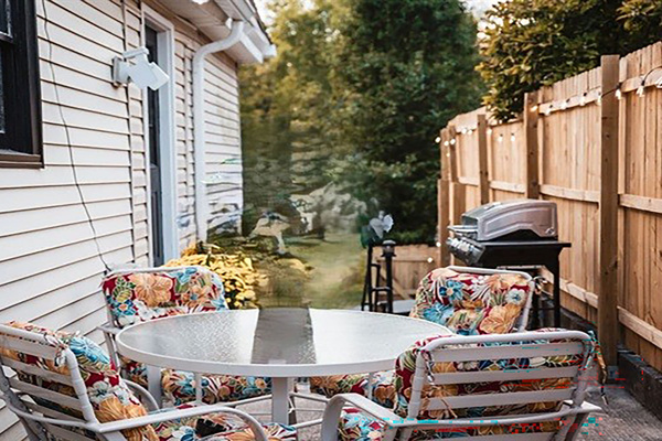 Grill patio. Cook out on the gas grill. Gather round the table and padded chairs (more chairs are available on the other patio).   
