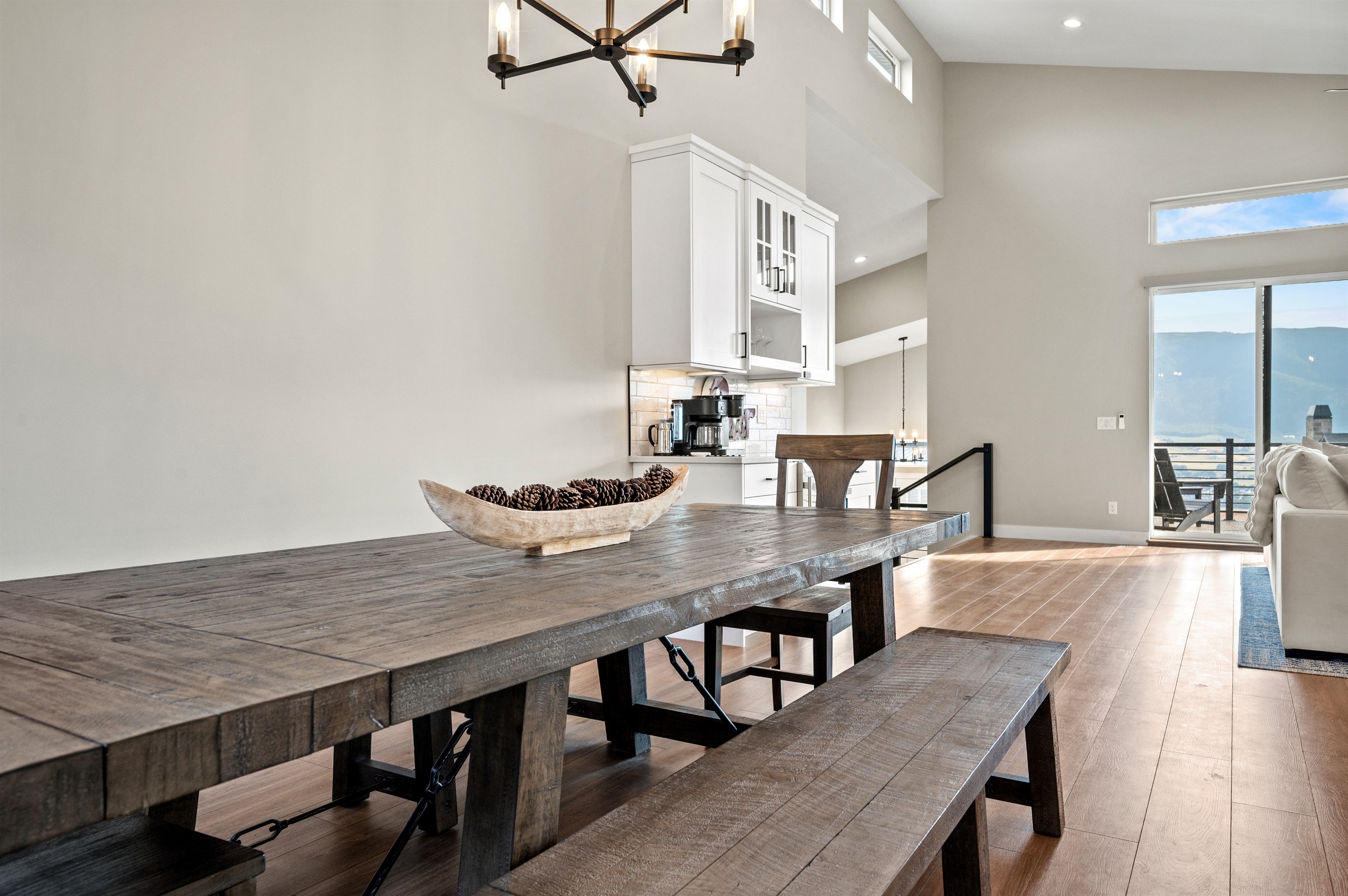 Scenic mountain beauty fills the living and dining areas and extends to the deck.