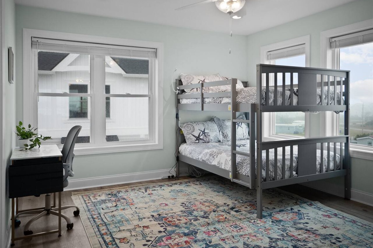 Full bunkbeds on third floor with desk