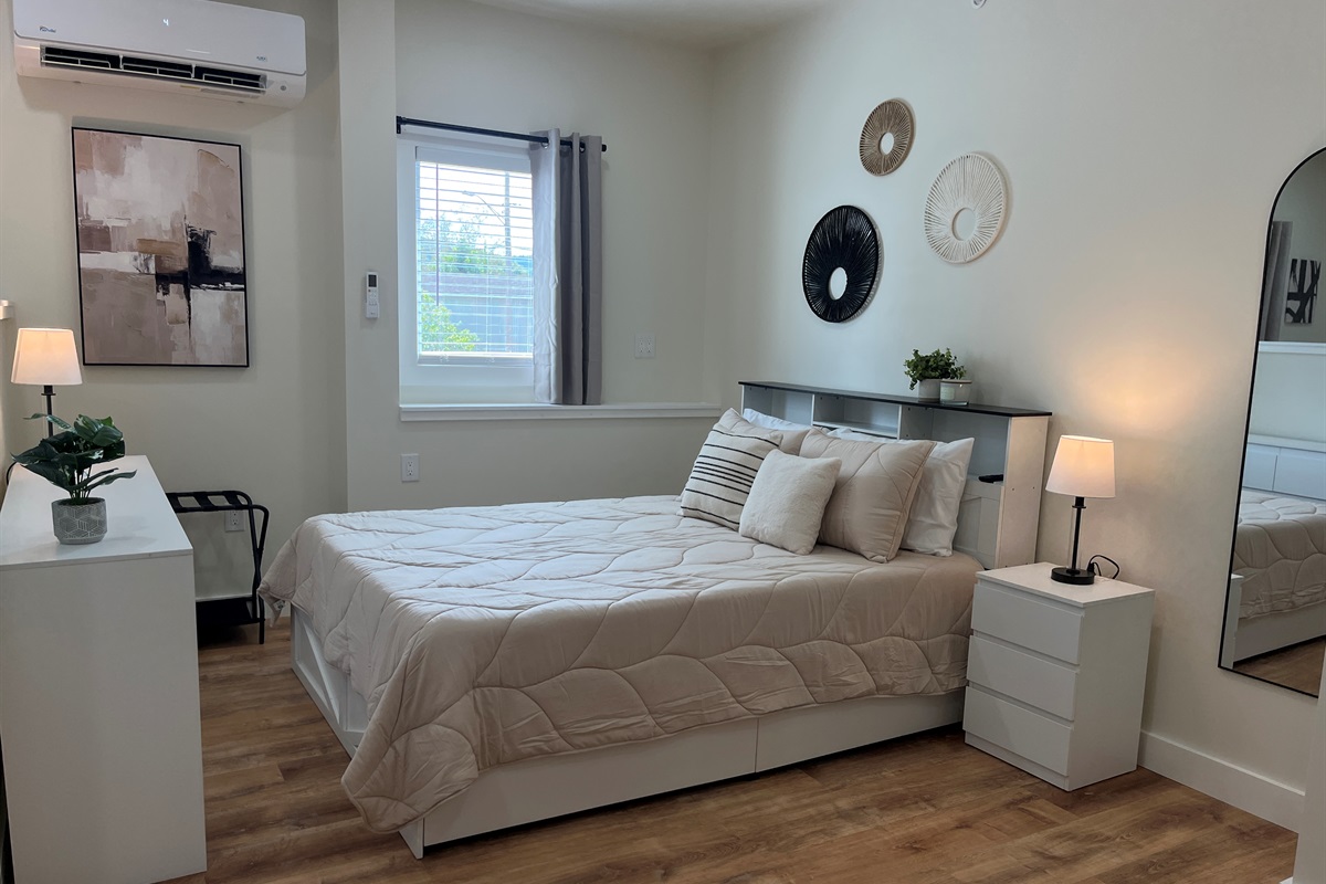 Queen bed in studio sleeping area