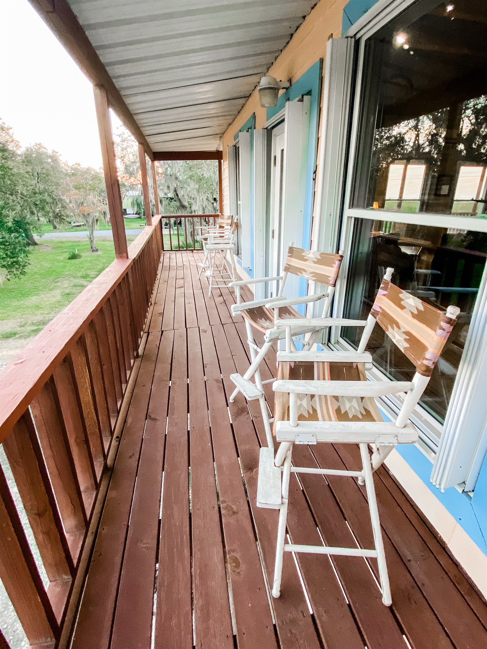 Relax on the covered front porch overlooking the canal.