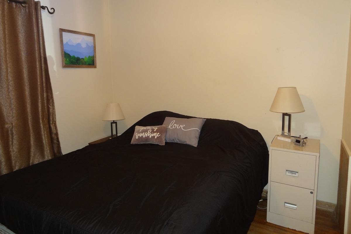 2nd Bedroom with queen bed, dresser, ceiling fan