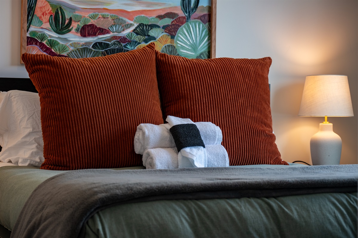 Cozy bedroom retreat with plush pillows and thoughtful touches.