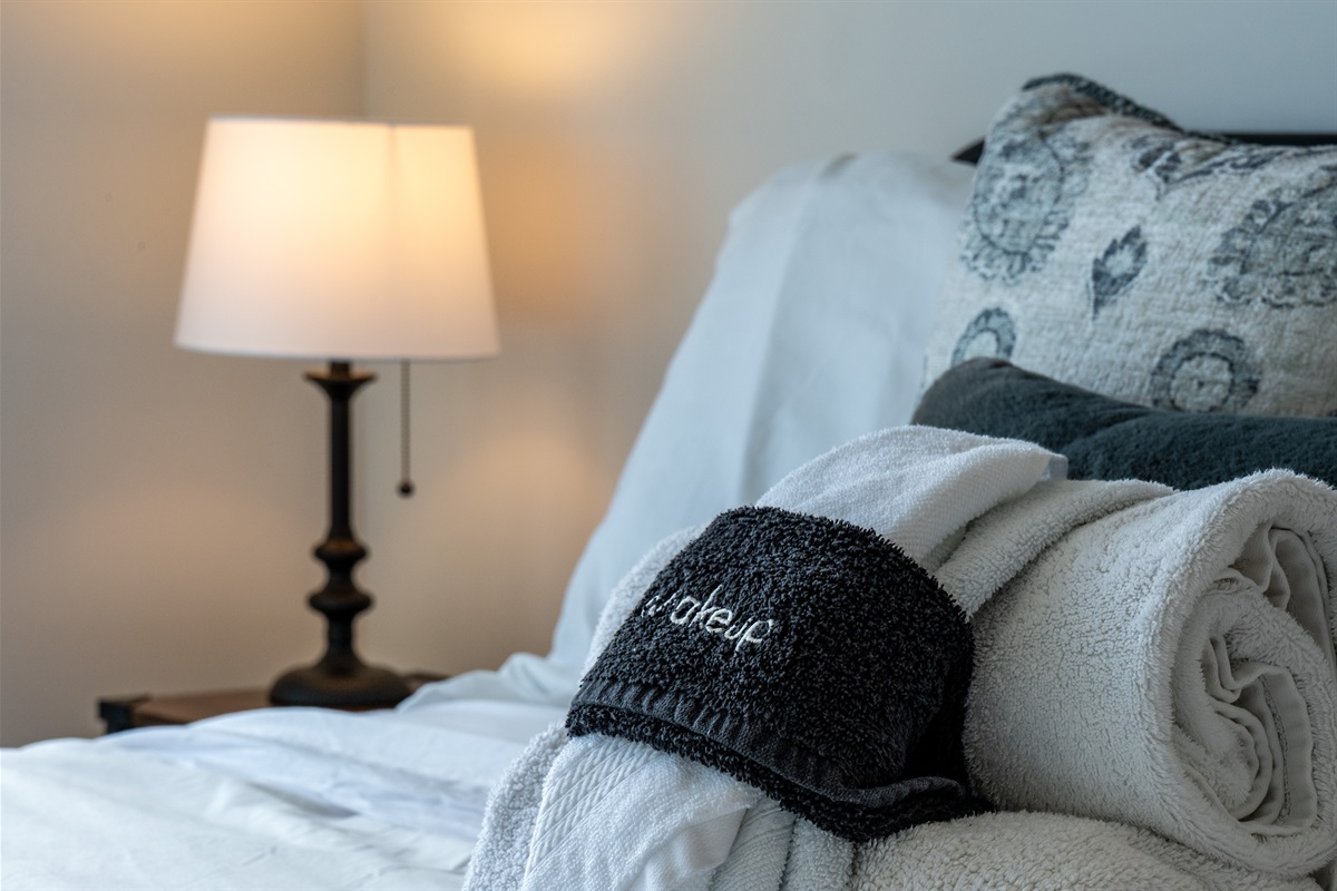 Warm and inviting bedroom décor with soft lighting and plush linens.