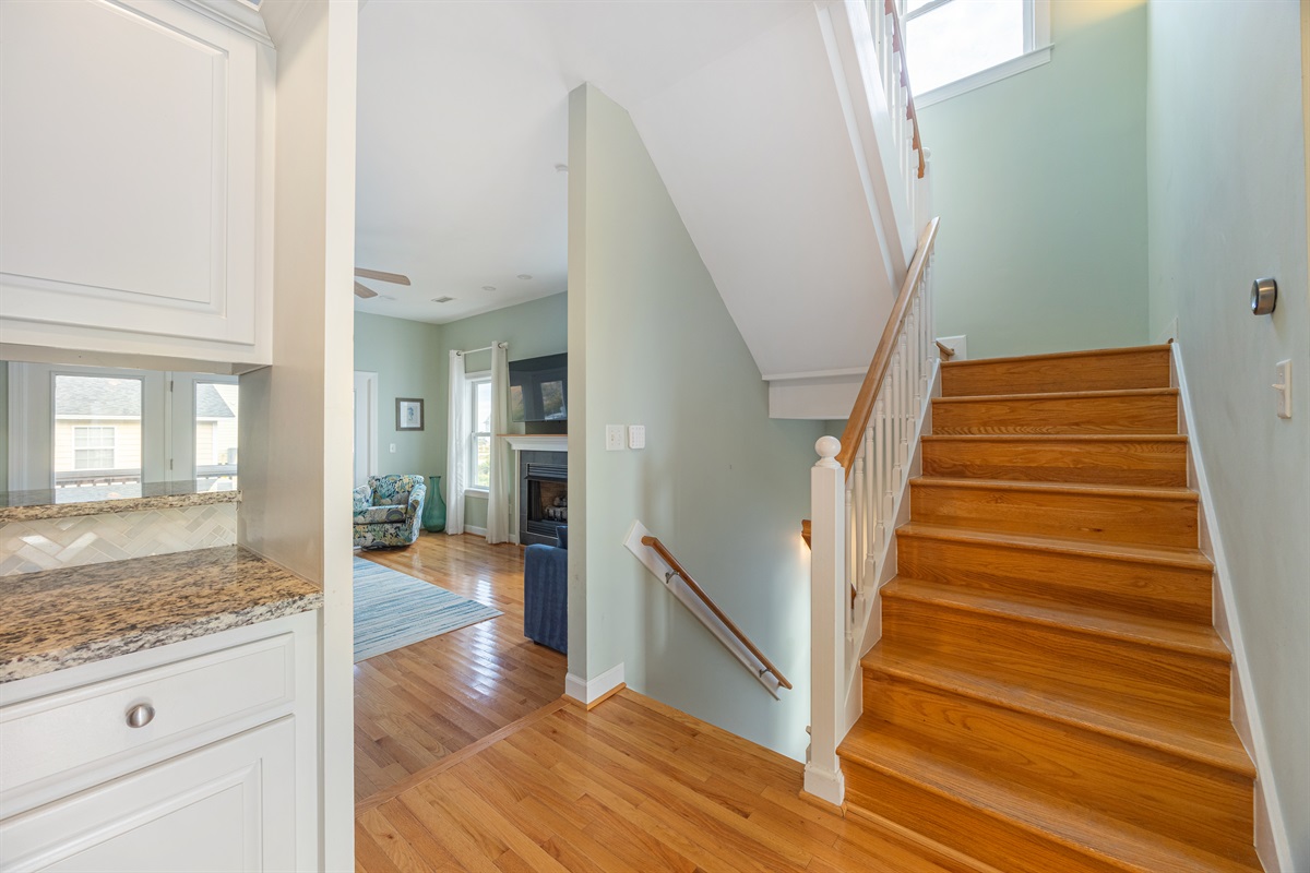 The main floor featuring a spacious living room, kitchen, and half bath