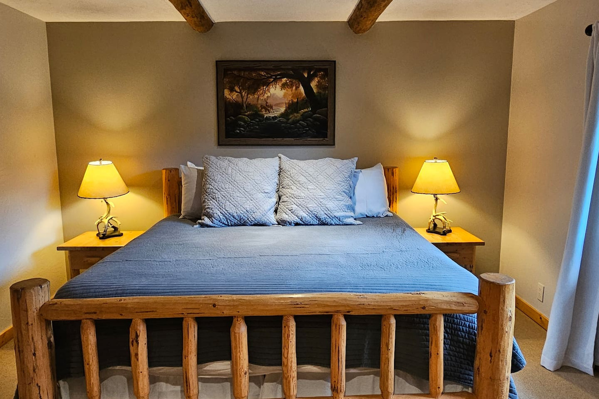 Bedroom 1 - king bed, large walk-in closet, en suite bathroom with separate sink and shower areas.