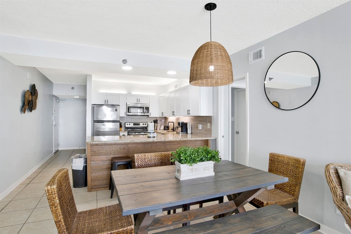 Solid handmade rustic wood table, with seating for 6+ (you can fit several on the bench if smaller!). Extra seating at the counter with barstools behind the table.