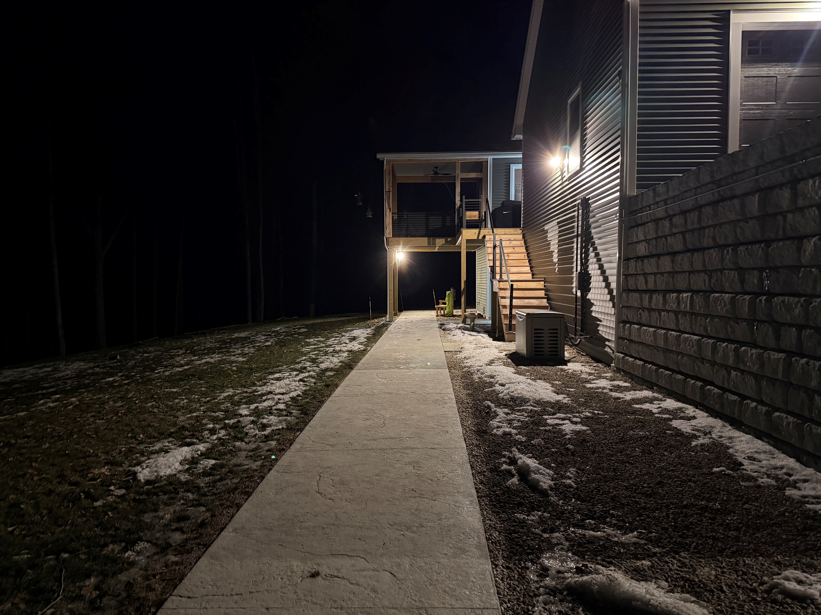 Path from driveway to front door motion-activated lights and flood light/cameras