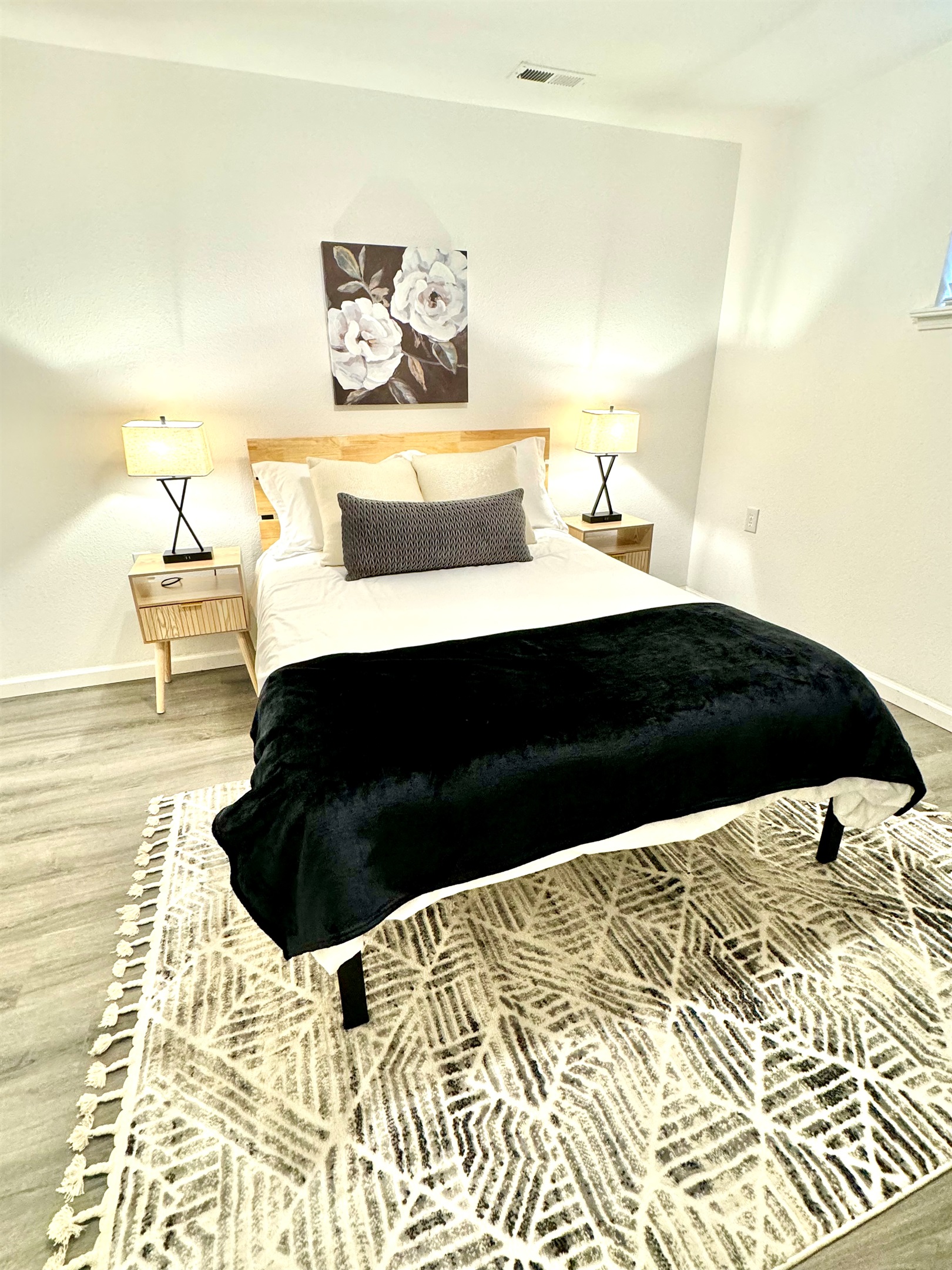 Basement bedroom with double bed and desk