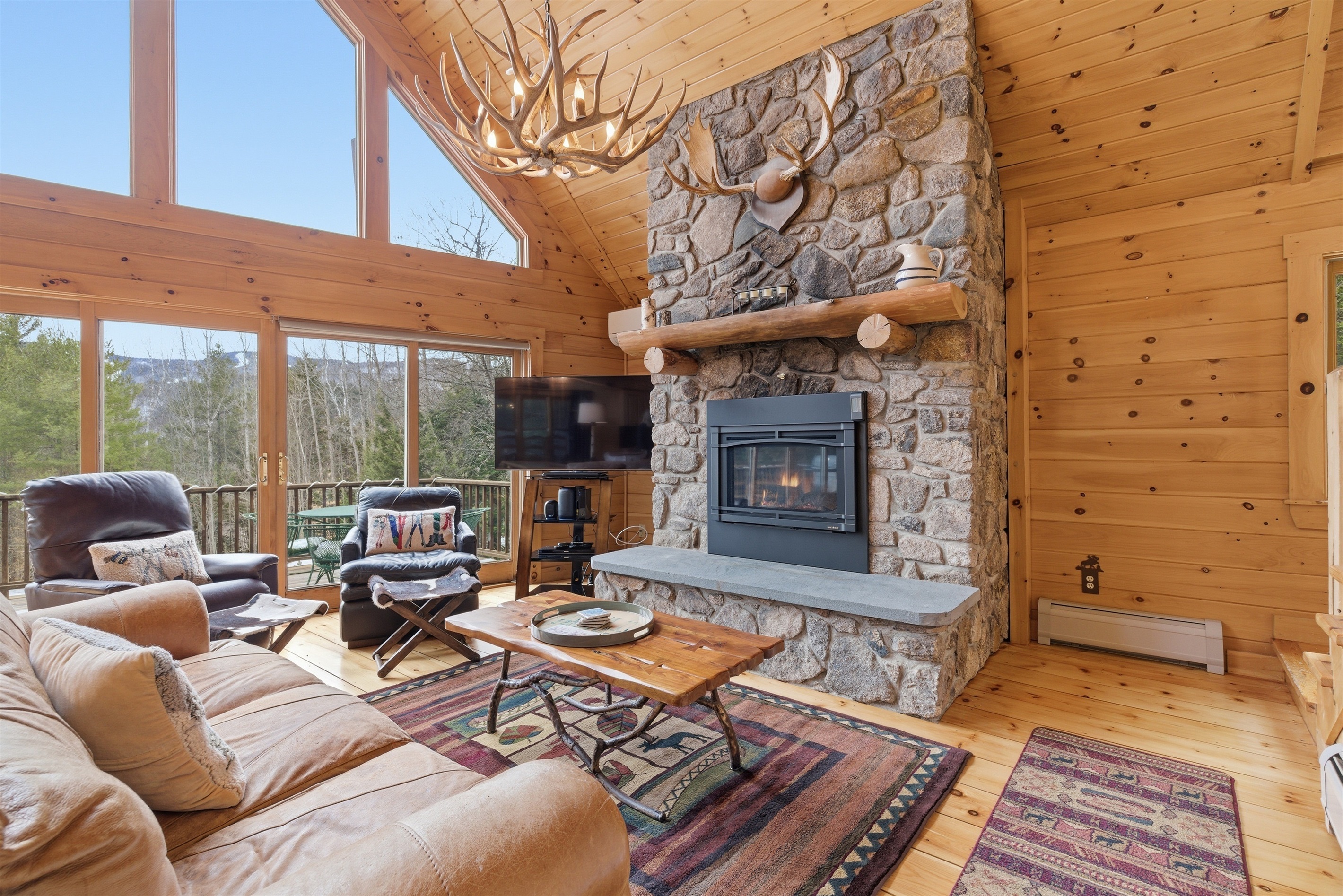 A warm and inviting gathering space with comfortable seating and a fireplace.