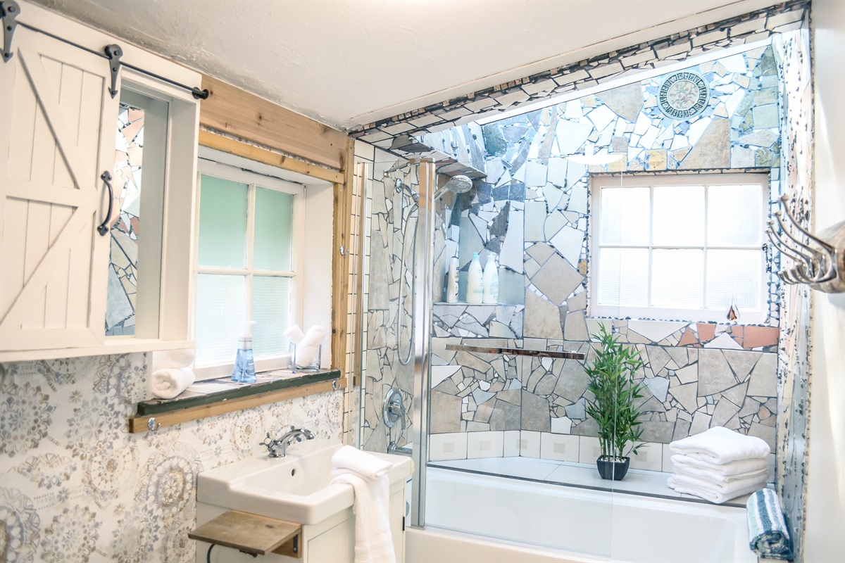 Remodled bathroom with skylight above tub