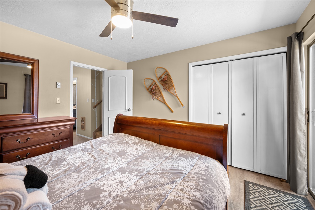 Peaceful bedroom retreat with cozy linens and mountain-inspired décor for a restful night's sleep.