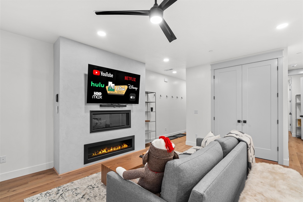 Cozy fireplace and smart TV — the ultimate hangout.