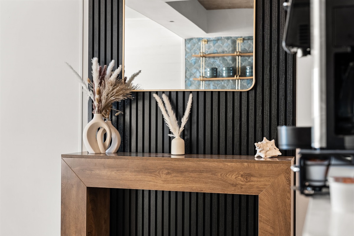 A convenient reception table and large mirror for your way in or out!