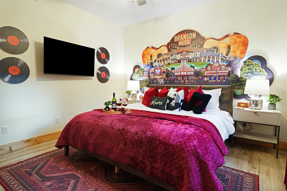 Luxury king mattress with large smart TV and attached ensuite bathroom