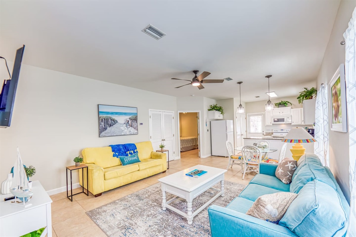 Living Room: Bright and airy retreat with vibrant decor, perfect for relaxing after beach adventures!