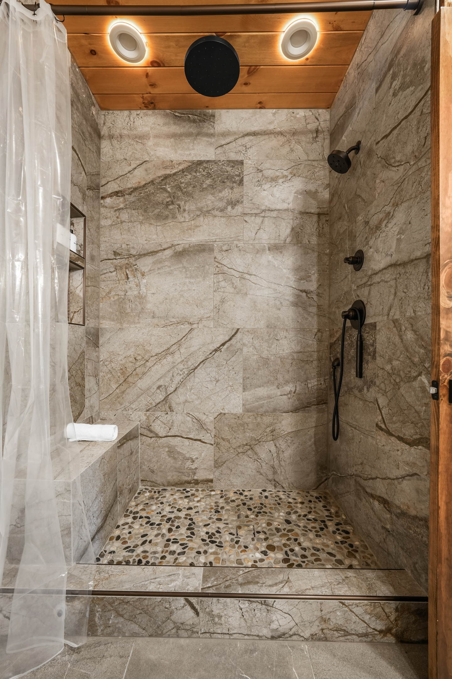Main Floor Master King Suite –Enjoy the luxurious spa-style shower with a rain, hand & full shower head for the perfect start or end to your day. Plush towels & premium sulfate / paraben free shampoo, conditioner & body wash are provided.
