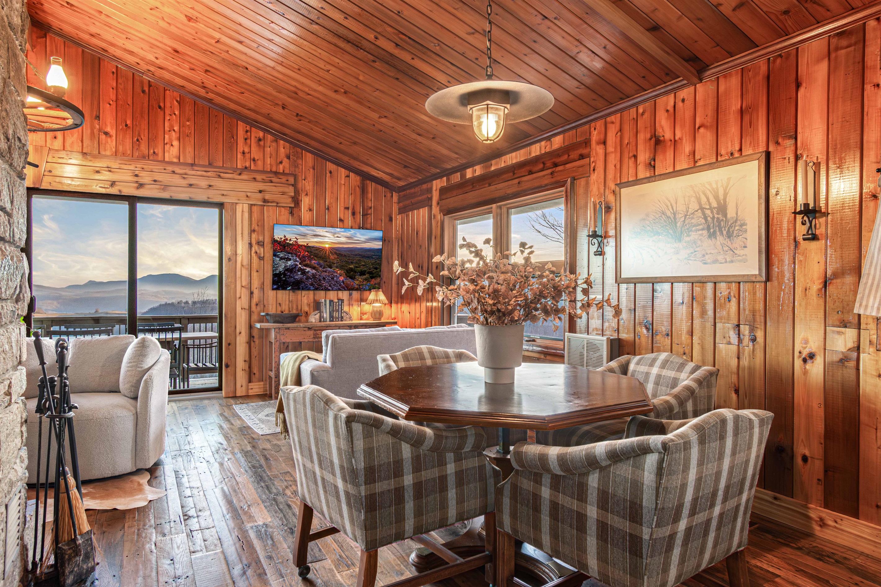 A cozy dining nook with mountain views—perfect for family meals, game nights, or slow mornings with coffee, surrounded by the charm of the original cabin.