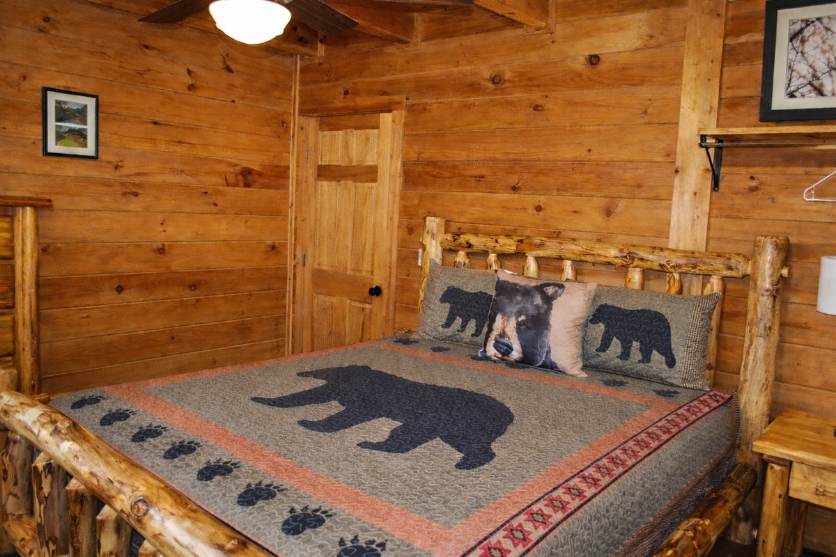 Main level bedroom with queen bed. 