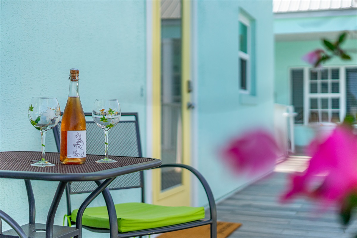 Quaint balcony overlooking community courtyard with shops and restaurants!