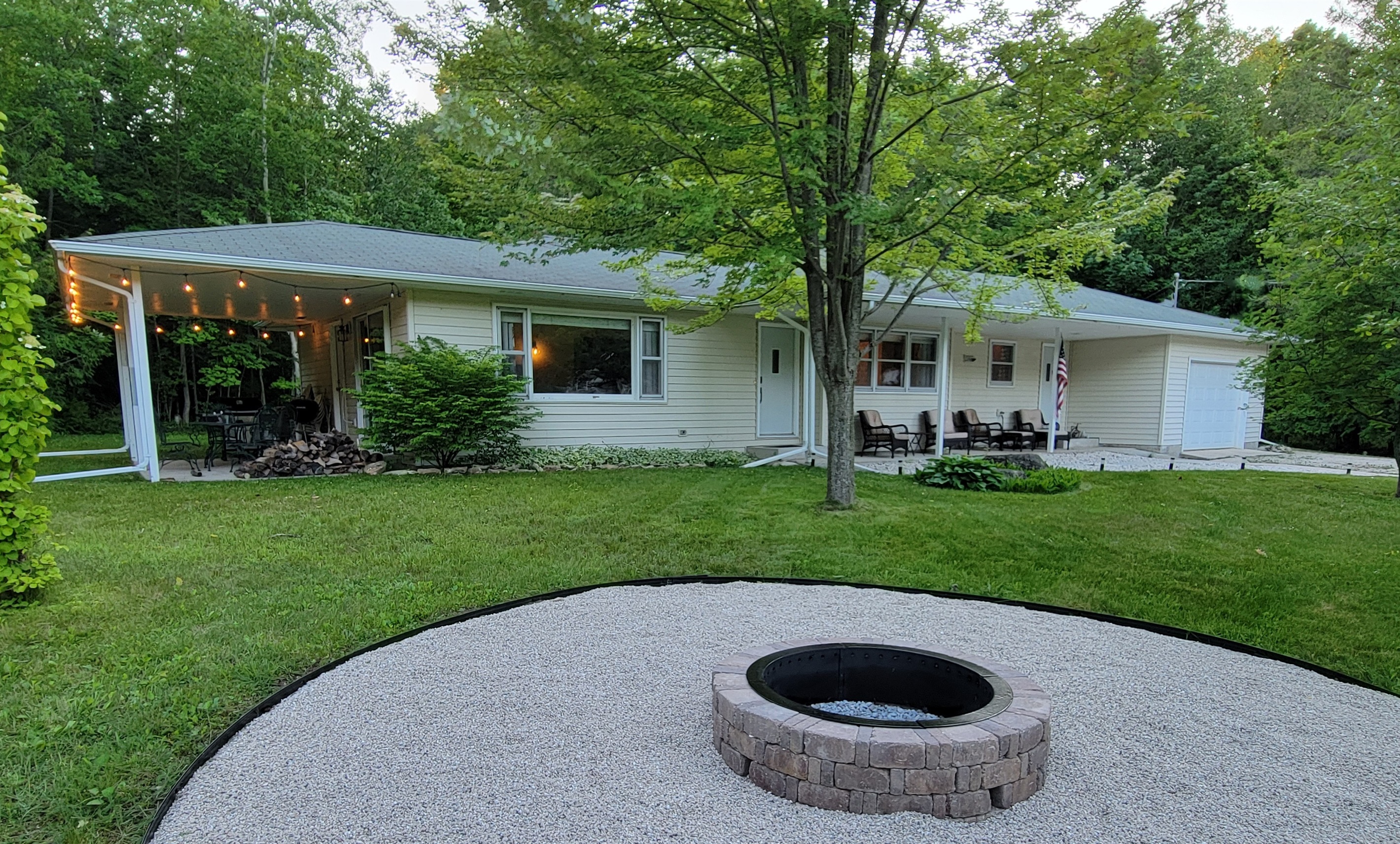Front Cottage View: patio string lights for evening ambience
