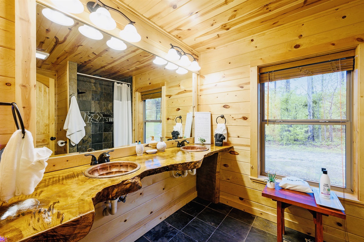 Master bath with double vanity and live edge countertop