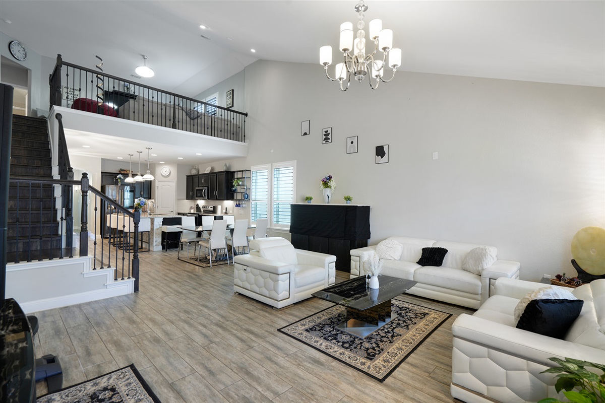 🛋 Living Room “Cathedral ceilings, leather seating, and vibes that feel like vacation.”