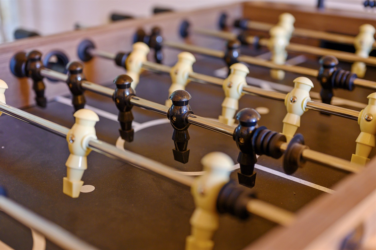 Score some fun and friendly competition with our foosball table!