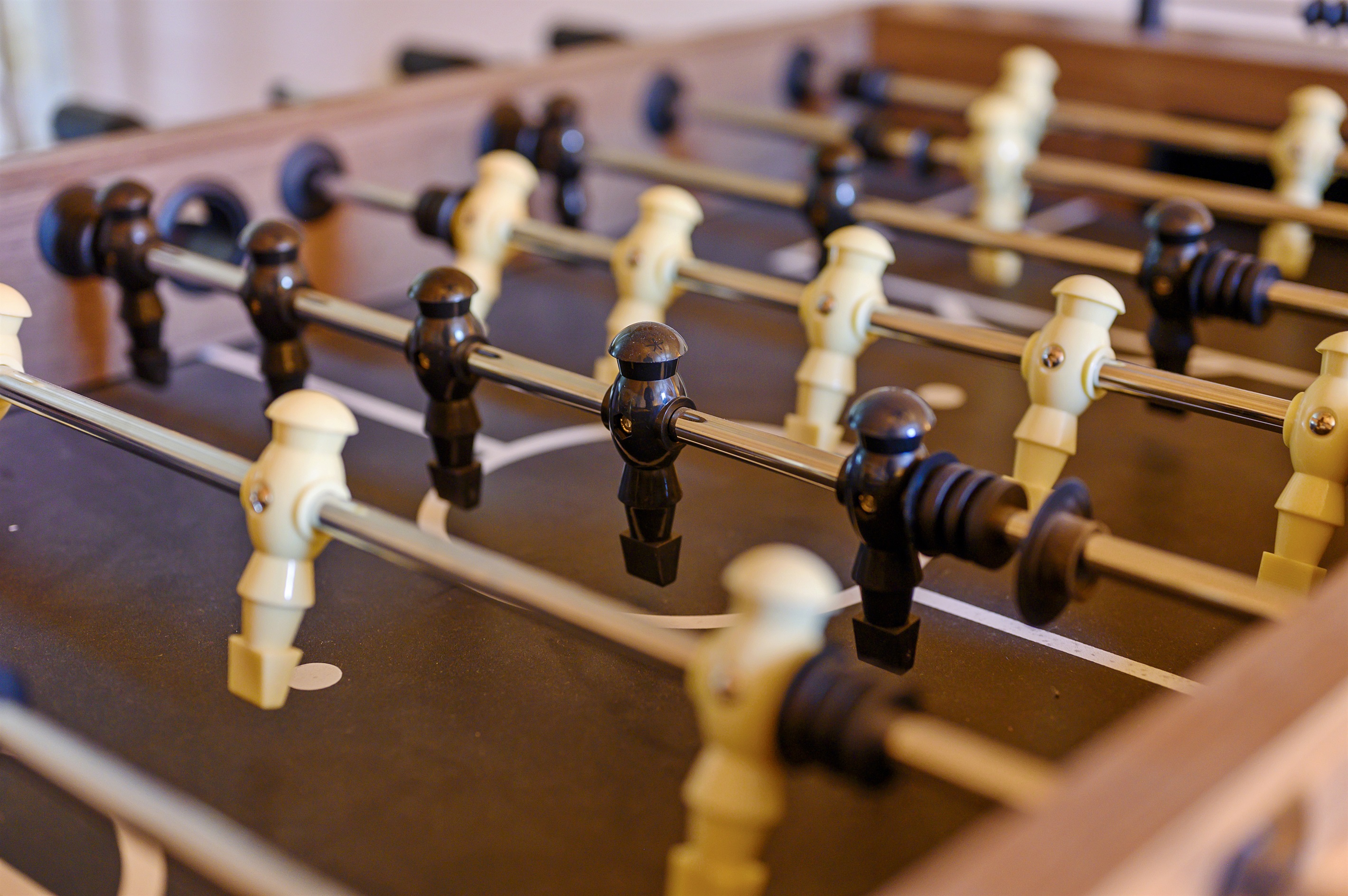 Score some fun and friendly competition with our foosball table!