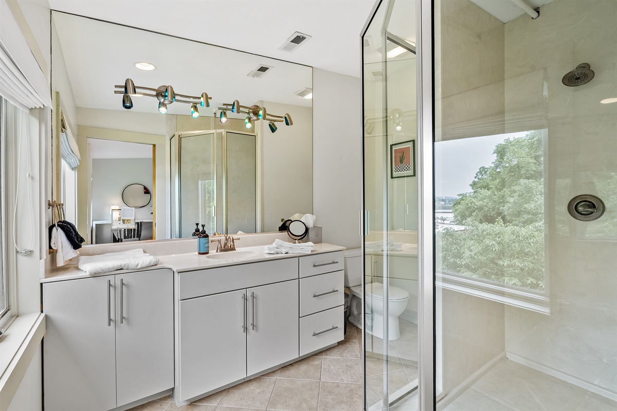 Modern ensuite featuring a spacious walk-in shower.