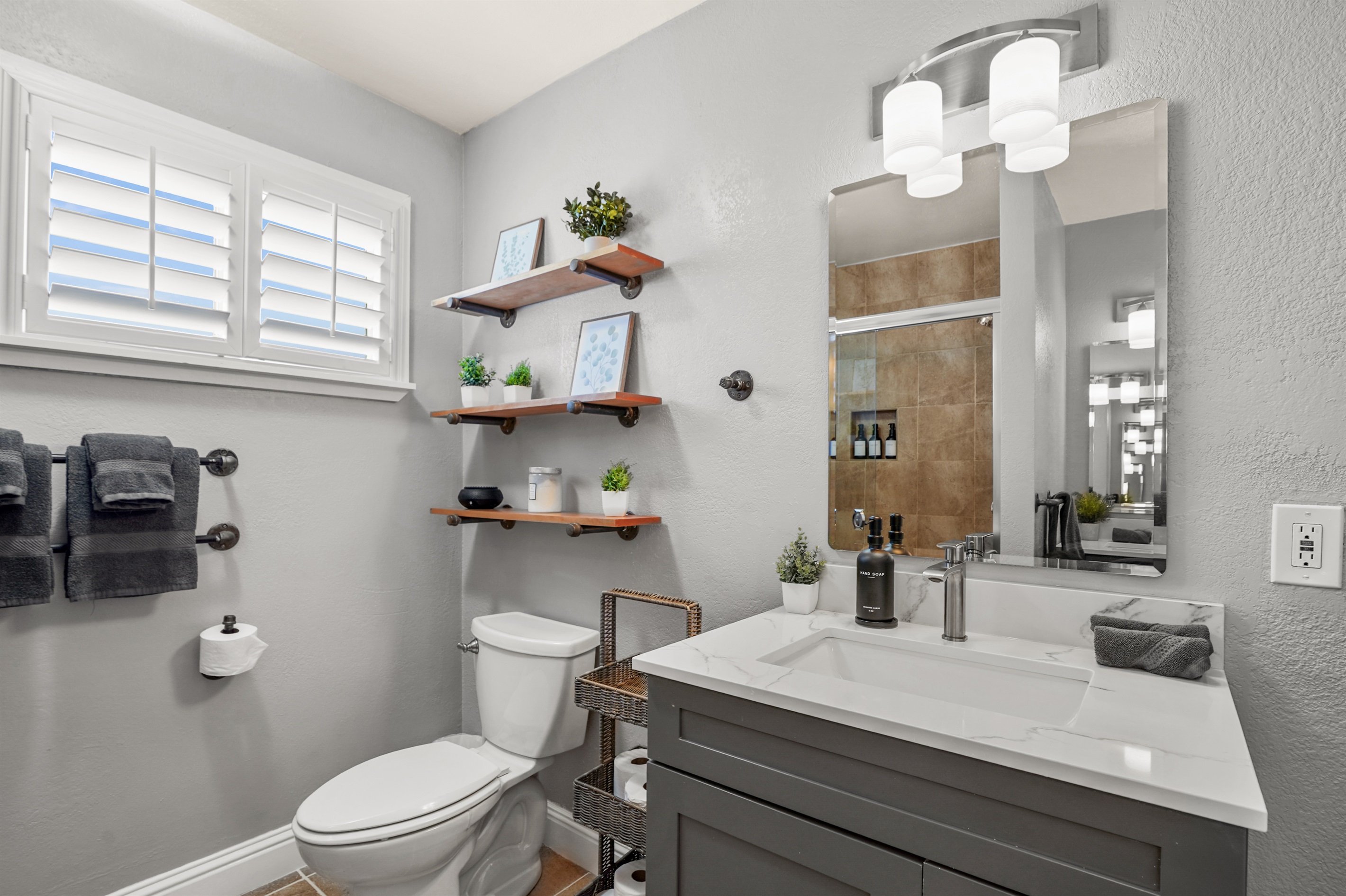 Private ensuite bathroom connected to the primary suite featuring dual sinks and a spacious layout.