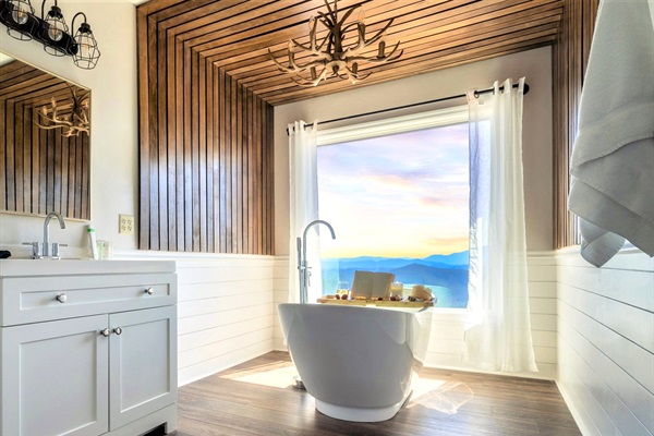 An ensuite bathroom from the upper Master. Quite possibly the ONLY cabin in the Smokies that offers a front row seat of THE BREATHTAKING Mountain views from your very own freestanding tub.