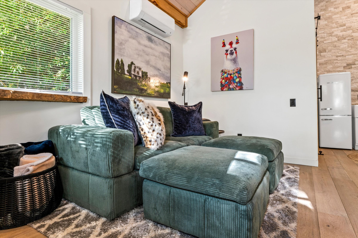 Cozy Living Room with 55-inch Smart TV, Fireplace, and bistro table.