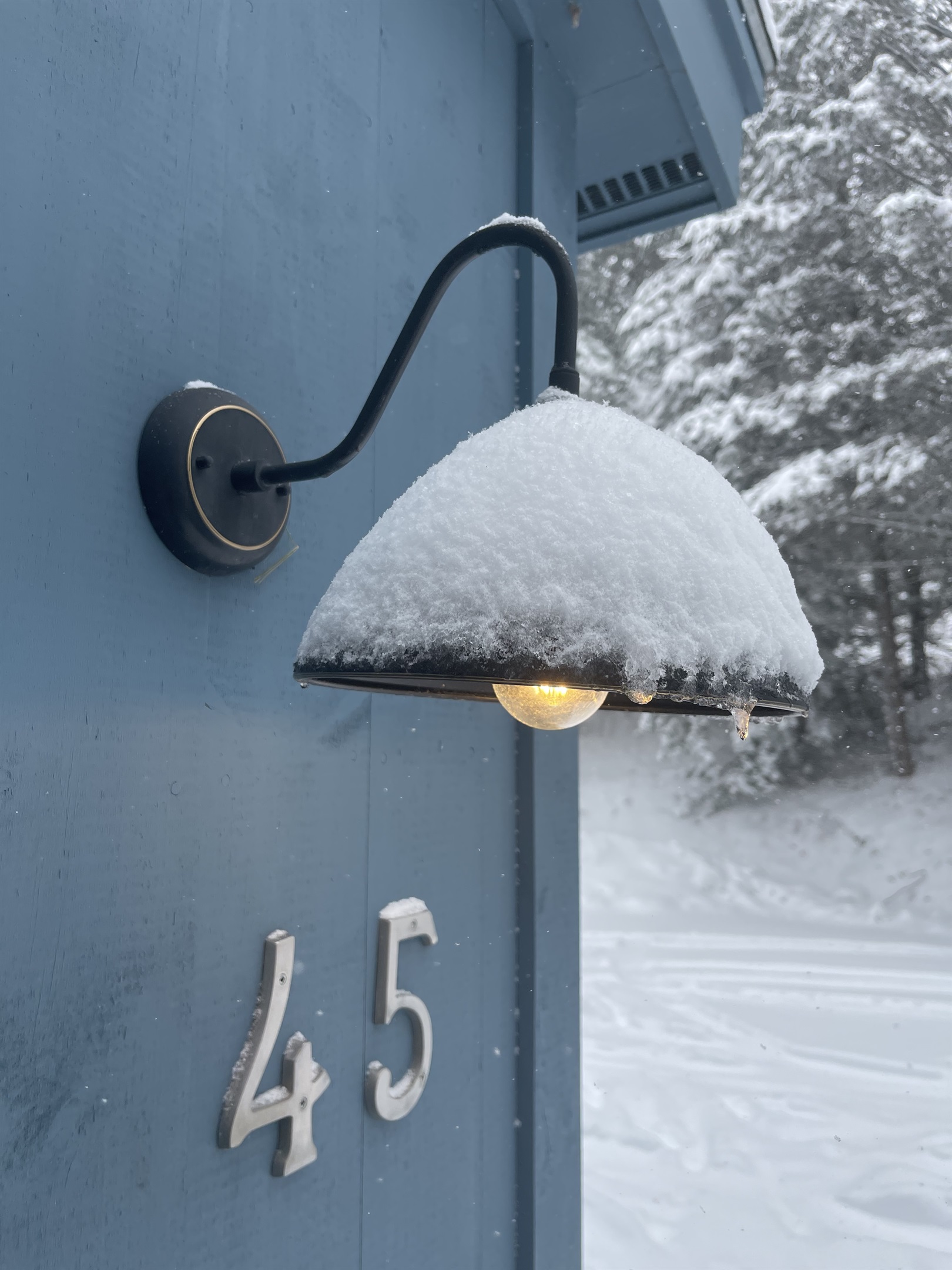 Hanging lamps light up the porch outdoors