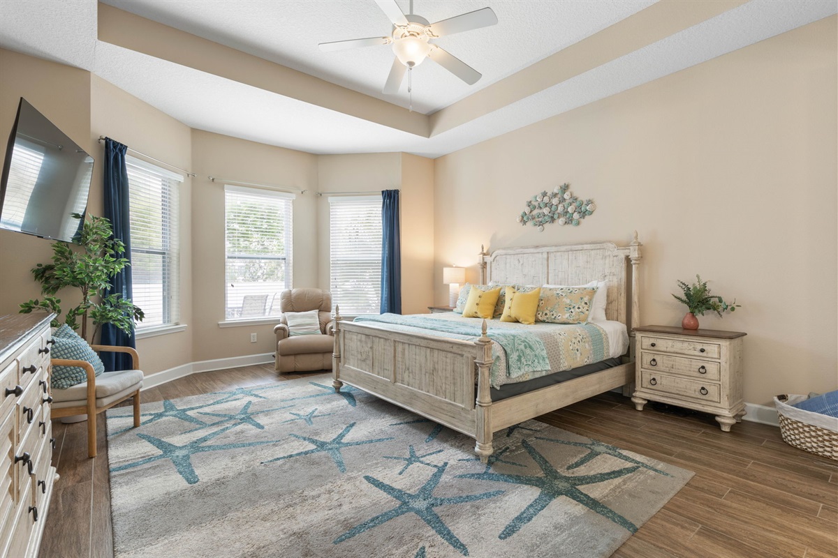 Wake slowly in this serene king retreat, where morning light spills through the windows, a quiet chair invites one more chapter, and the soft coastal palette makes every night feel restful, romantic, and wonderfully removed from the world.