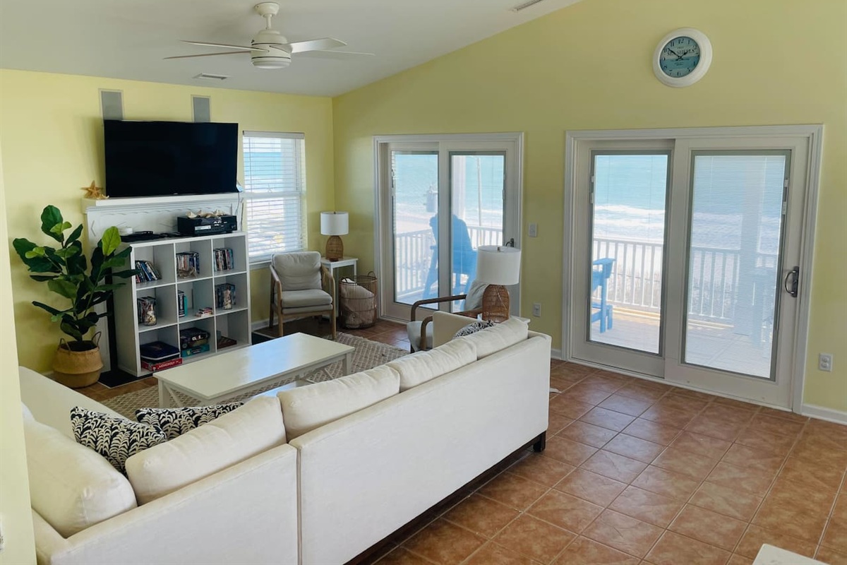 Living space with ocean views and large TV. Notice in-ceiling speakers for surround sound. Connect to stereo system with your phone via bluetooth.