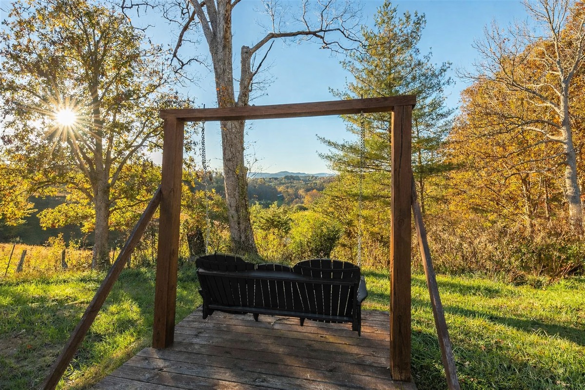 Golden hour, mountain air, nowhere else to be. Set on 2 private mountain acres, there are endless Blue Ridge views at Summit House.