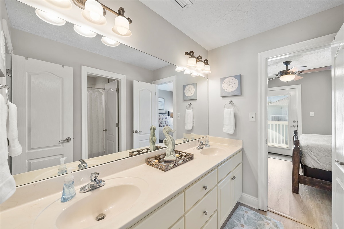 Two sinks plus a separate shower area makes this bathroom perfect for multiple people getting ready.