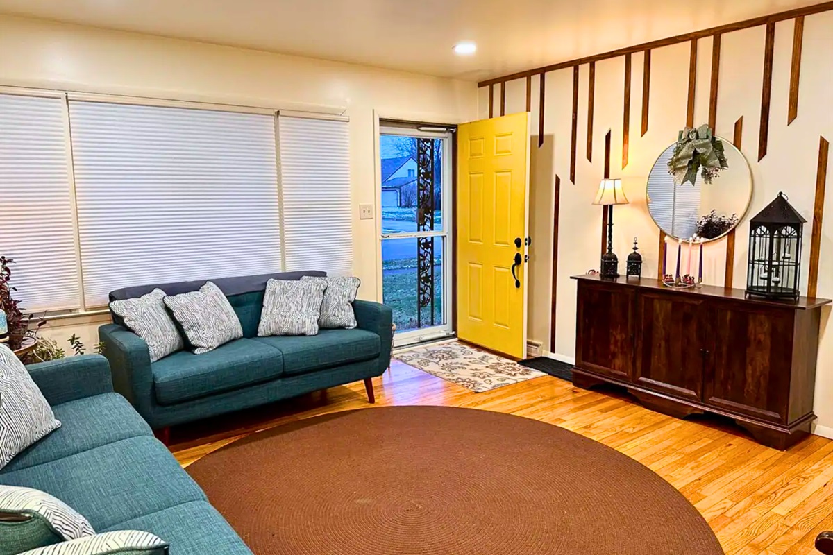 Open and Cozy Living Room with Colorful Accents and Decor