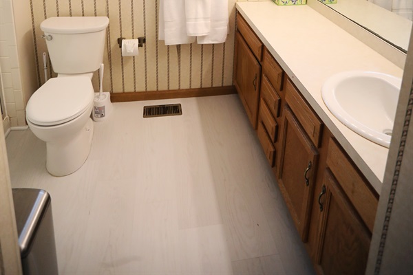 Master Suite full bathroom full bathroom showing toilet, sink, walk-in shower to the left