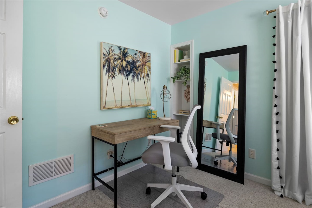 Workspace with adjustable office chair, on rolling mat. 