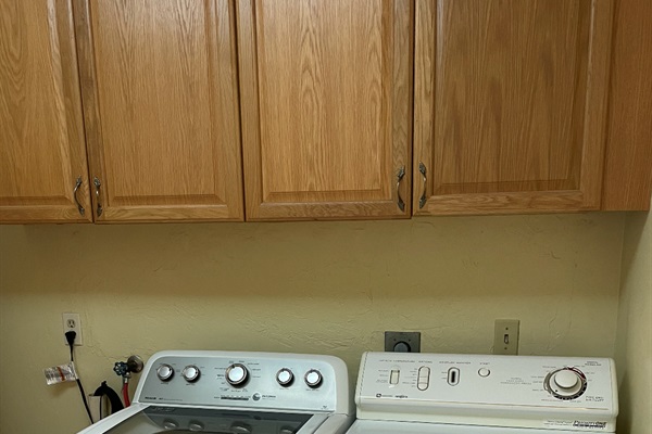 The laundry room is located just off the kitchen.