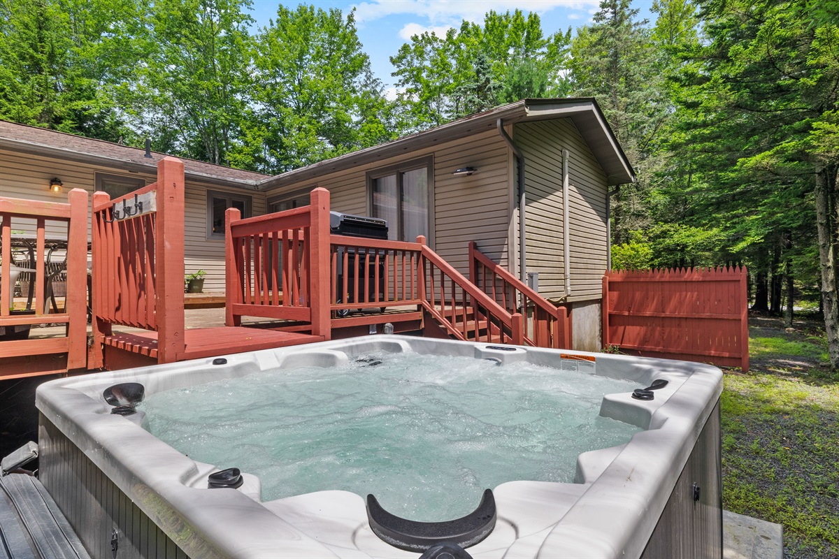 Backyard spa vibes—hot tub ready for relaxation any time of day