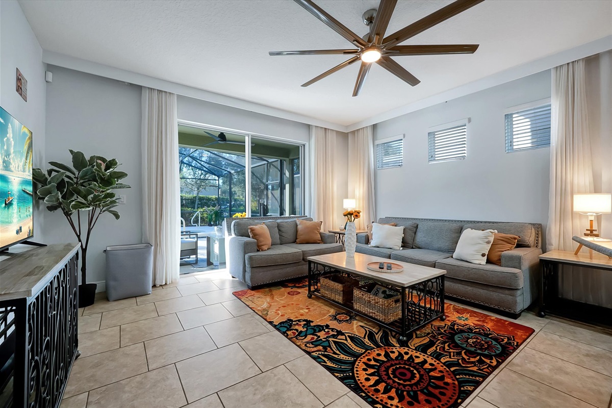 The downstairs living room has lots of sunlight.