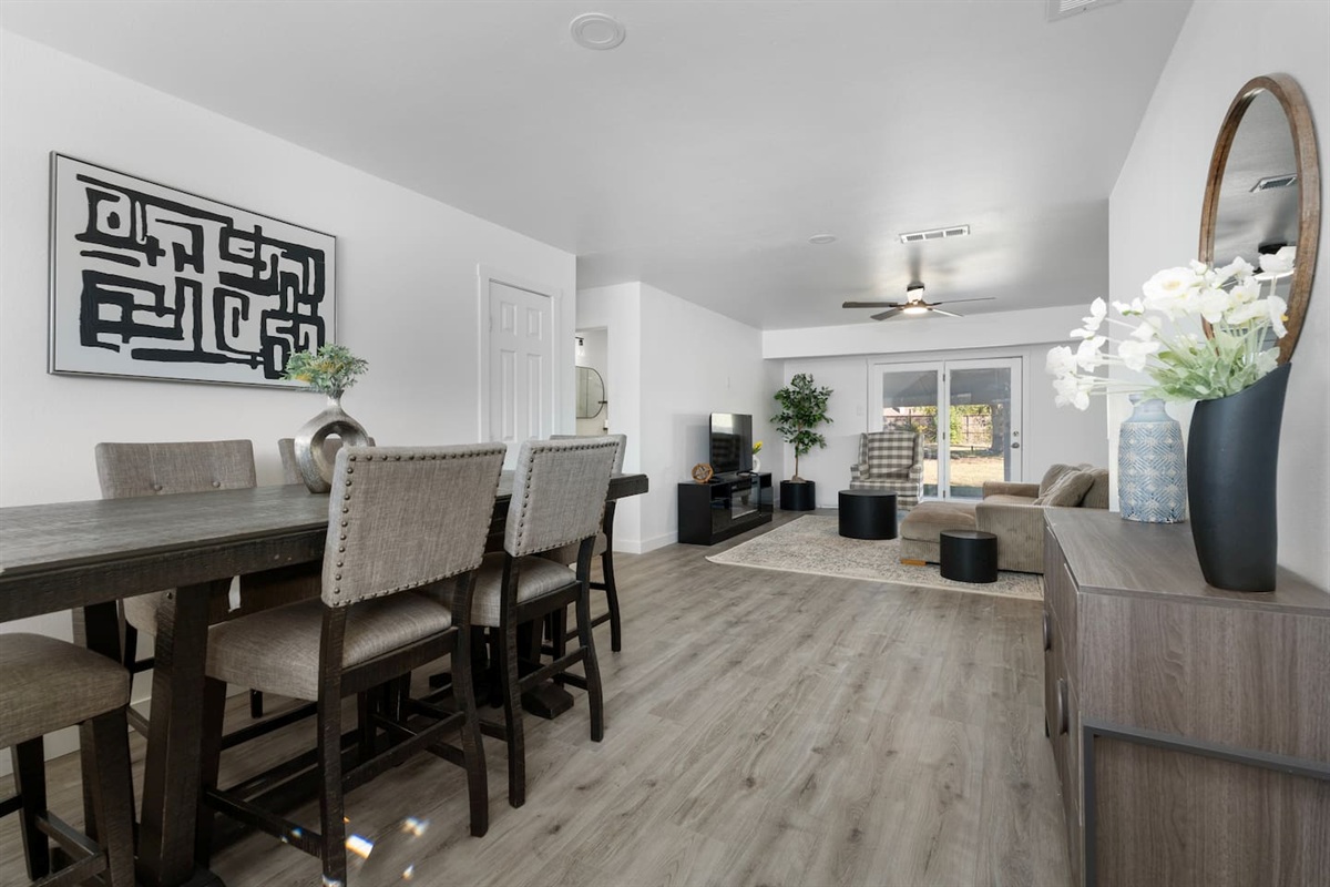 Bright dining area with seating for six, perfectly placed between the kitchen and living room for easy family meals and open-concept gathering.